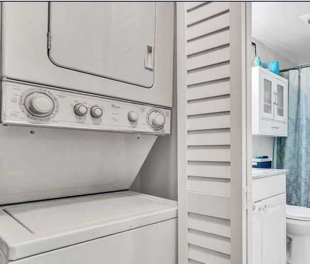 washroom with stacked washer / dryer