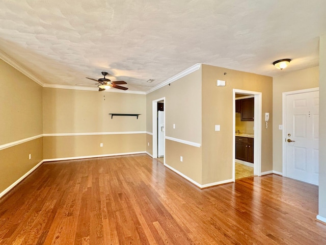 living area featuring ornamental molding and dark colored carpet