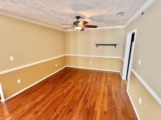 unfurnished room featuring ornamental molding, hardwood / wood-style floors, and ceiling fan