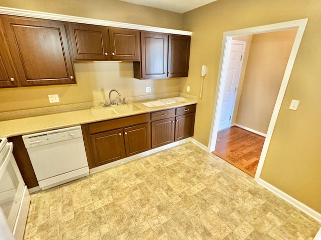 kitchen featuring dishwasher, light wood-type flooring, and sink