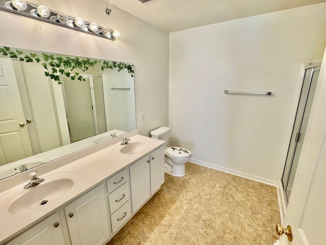 bathroom with walk in shower, vanity, and toilet