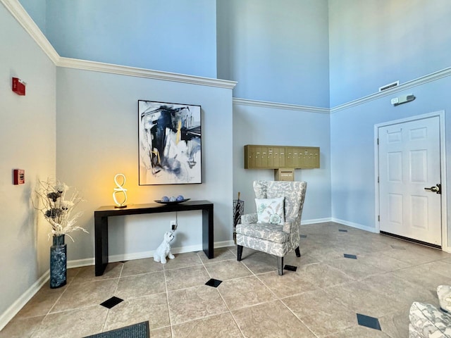 sitting room with light tile patterned flooring and crown molding