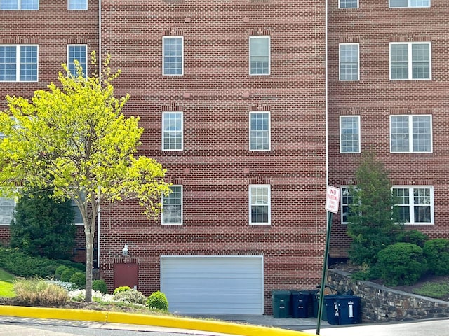 view of building exterior featuring a garage