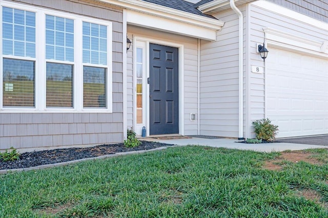 doorway to property featuring a garage