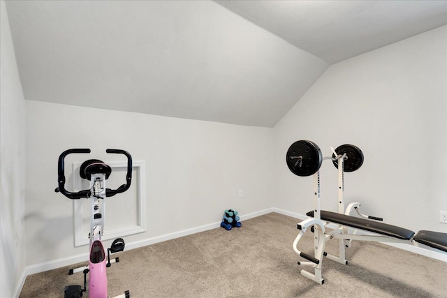 workout area featuring lofted ceiling and carpet flooring