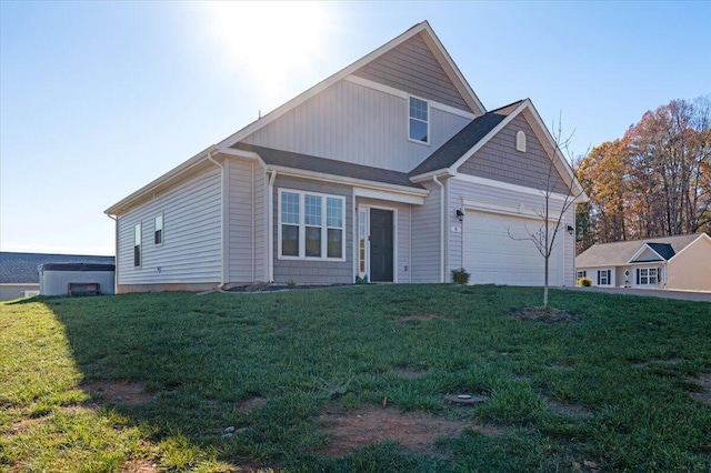 view of front of home featuring a garage and a front lawn