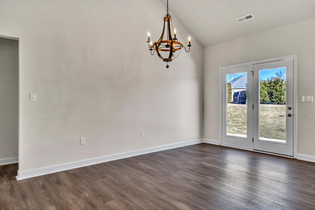 unfurnished room featuring dark wood-style flooring, visible vents, baseboards, vaulted ceiling, and an inviting chandelier