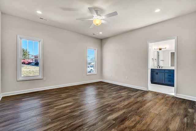 unfurnished bedroom featuring dark wood-style floors, recessed lighting, visible vents, and baseboards