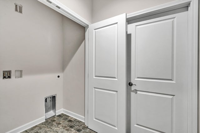 laundry room featuring baseboards, laundry area, and hookup for an electric dryer