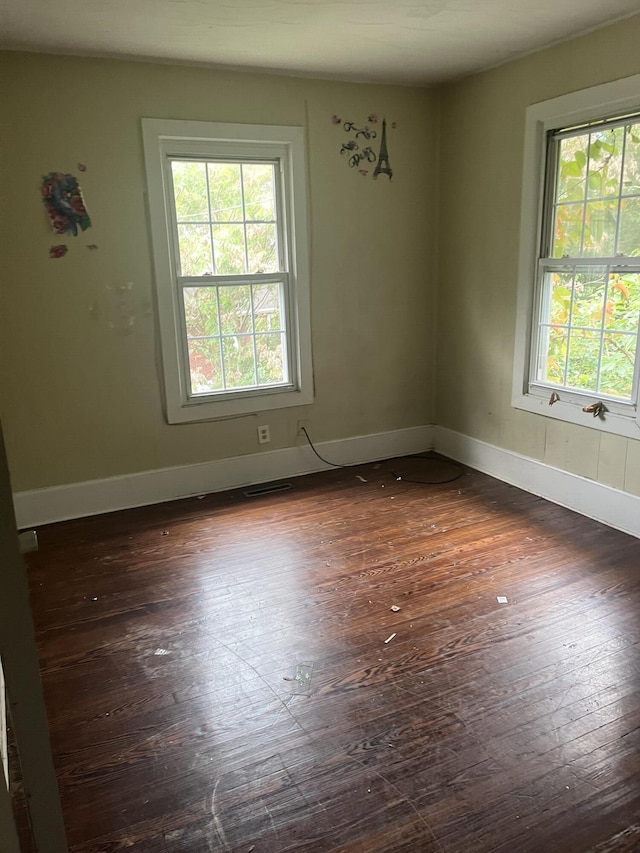 802 Morrill Ave SE, Roanoke, VA 24013 - empty room with dark wood-style flooring and baseboards