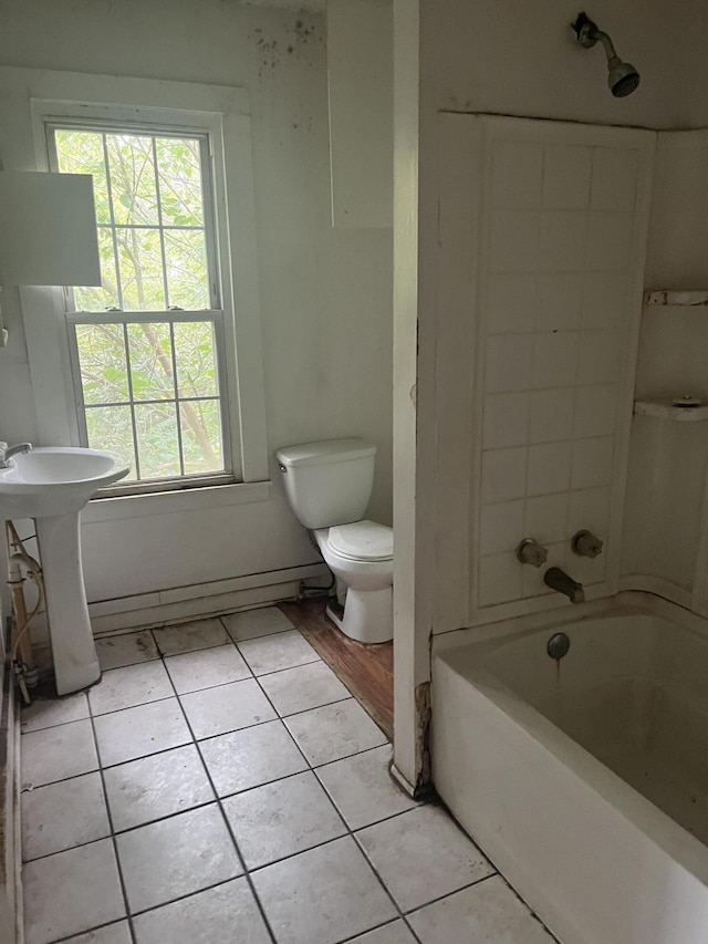 802 Morrill Ave SE, Roanoke, VA 24013 - full bath featuring tile patterned flooring, toilet, a sink, and  shower combination