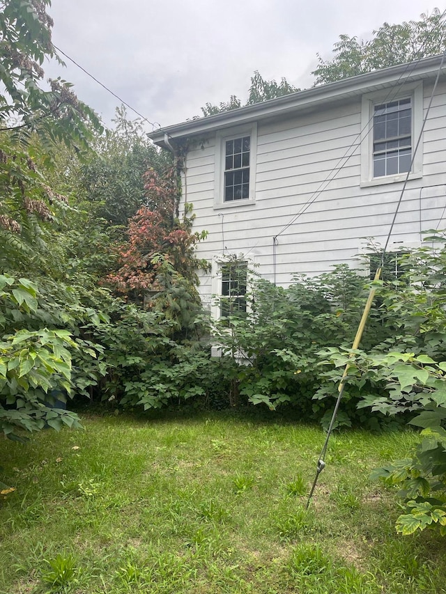 view of home's exterior featuring a lawn