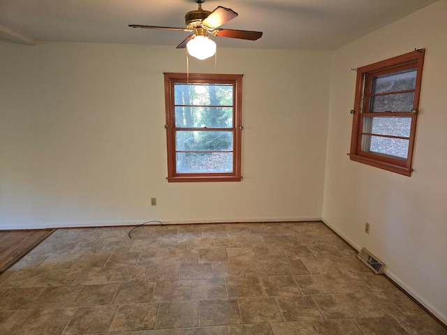 spare room featuring ceiling fan