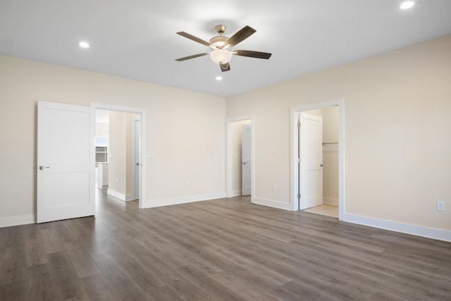 6913 Doral Dr, Radford, VA 24141 - unfurnished bedroom with recessed lighting, baseboards, dark wood-style floors, and a walk in closet
