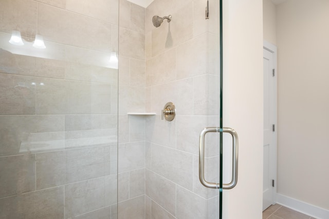 6913 Doral Dr, Radford, VA 24141 - full bathroom with tile patterned floors, baseboards, and a shower stall