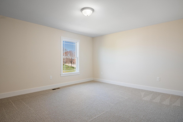 6913 Doral Dr, Radford, VA 24141 - spare room featuring baseboards, visible vents, and light colored carpet