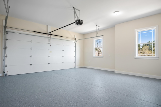 6913 Doral Dr, Radford, VA 24141 - garage with baseboards and a garage door opener