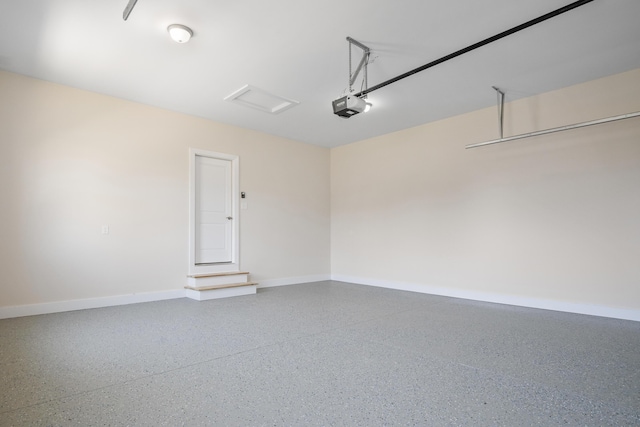6913 Doral Dr, Radford, VA 24141 - garage with baseboards and a garage door opener