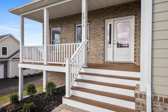 6913 Doral Dr, Radford, VA 24141 - view of exterior entry with covered porch and brick siding
