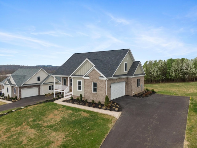 6913 Doral Dr, Radford, VA 24141 - craftsman inspired home with a front lawn, driveway, brick siding, an attached garage, and board and batten siding