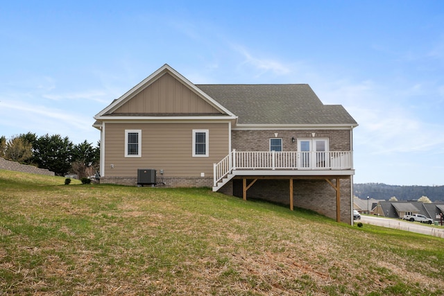 6903 Doral Dr, Radford, VA 24141 - back of house featuring cooling unit, a yard, a shingled roof, and a deck