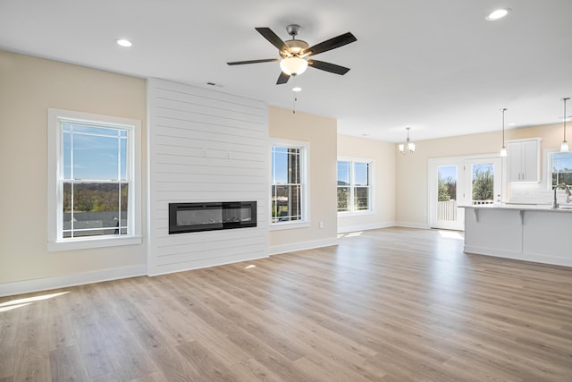 6903 Doral Dr, Radford, VA 24141 - unfurnished living room featuring recessed lighting, baseboards, visible vents, and light wood-type flooring