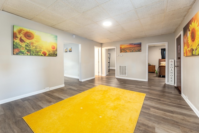 spare room featuring dark wood-type flooring