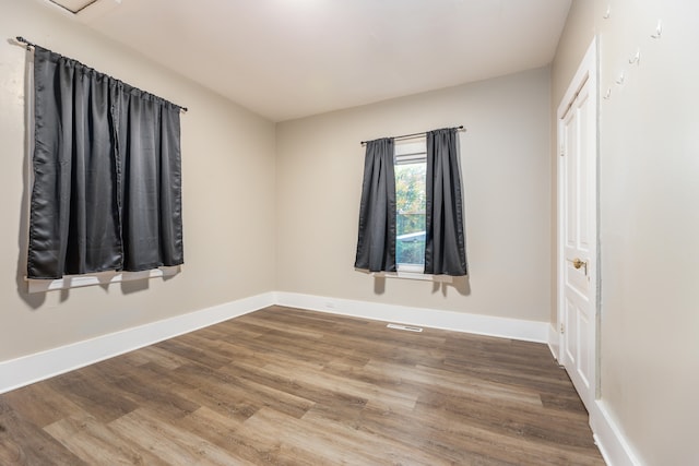 empty room featuring hardwood / wood-style floors