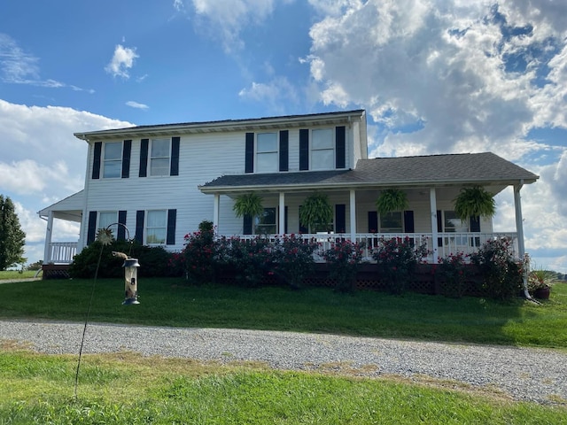 view of front of house with a front lawn and covered porch