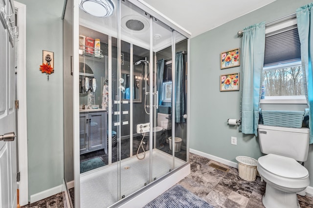 bathroom with toilet and walk in shower