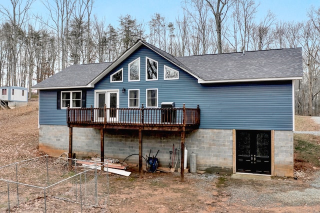 back of property featuring a deck