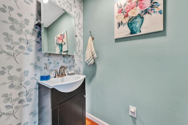 bathroom featuring vanity and hardwood / wood-style floors