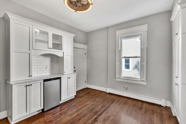 interior space featuring a baseboard heating unit, white cabinets, dark hardwood / wood-style floors, and stainless steel refrigerator