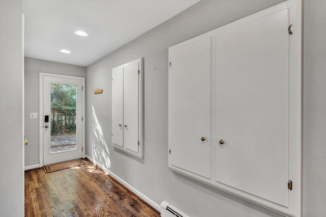 doorway to outside featuring dark hardwood / wood-style flooring