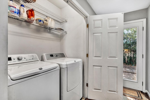 laundry area featuring washer and dryer and wood-type flooring