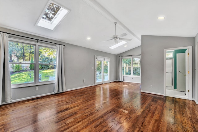 unfurnished room with lofted ceiling with skylight, ceiling fan, and dark hardwood / wood-style flooring