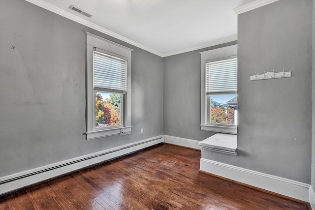 spare room featuring ornamental molding, a baseboard heating unit, and dark hardwood / wood-style flooring