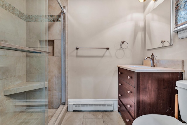 bathroom featuring toilet, an enclosed shower, vanity, and a baseboard radiator