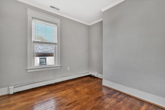 spare room featuring crown molding, dark hardwood / wood-style floors, and baseboard heating