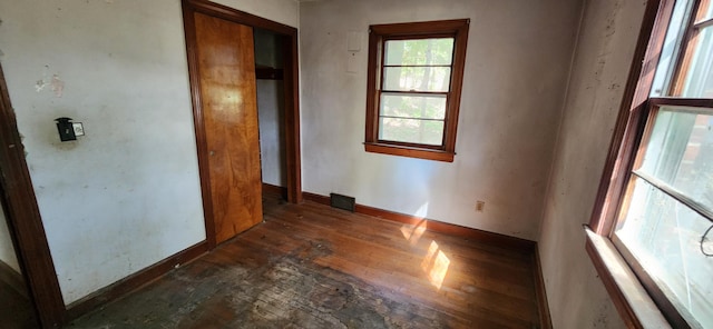 unfurnished room with dark hardwood / wood-style floors