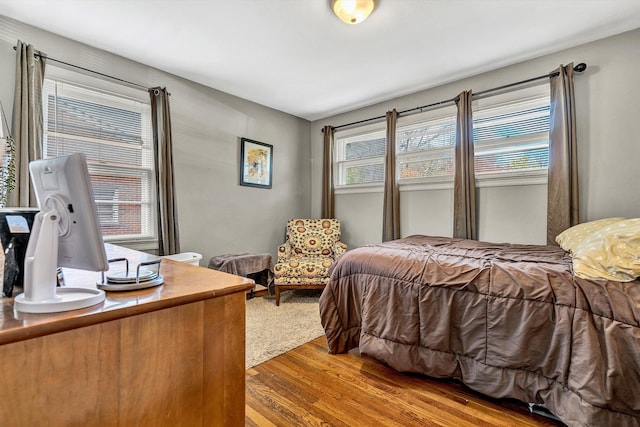 bedroom with light wood-type flooring