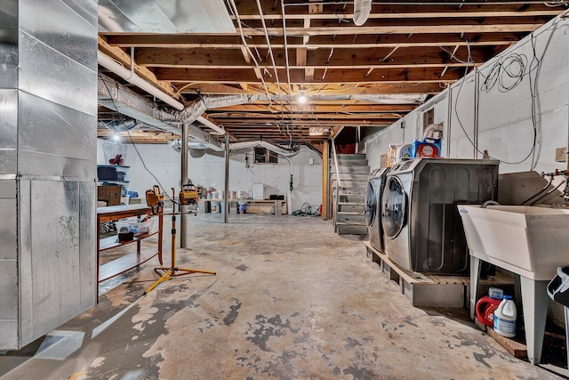 basement with washing machine and clothes dryer