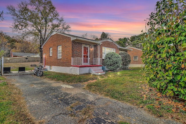 view of front of house with a lawn