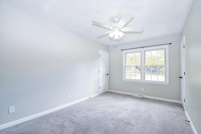 carpeted empty room with ceiling fan