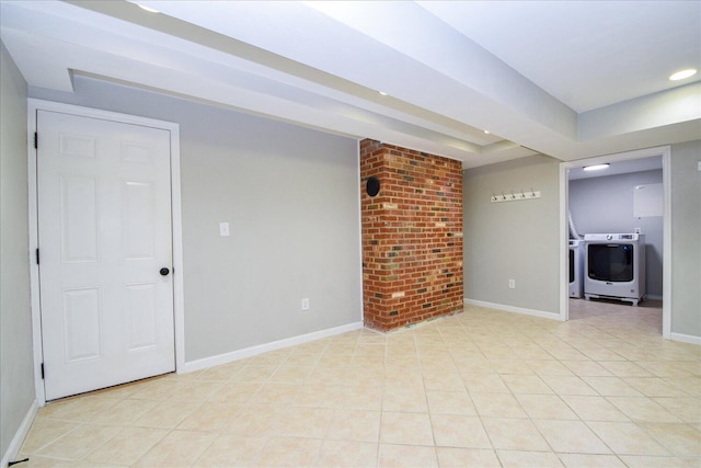 tiled empty room featuring washer and clothes dryer