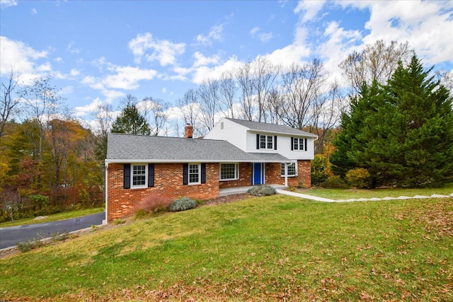 front facade with a front lawn