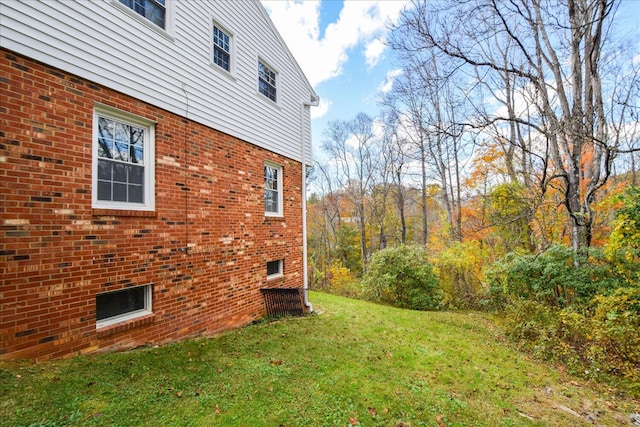 view of home's exterior with a lawn