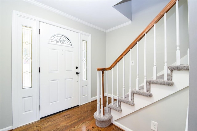 foyer entrance with crown molding and wood-type flooring