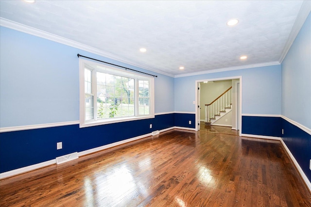 unfurnished room with crown molding and dark hardwood / wood-style flooring