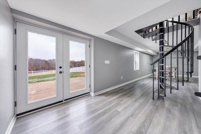 interior space with hardwood / wood-style flooring and french doors